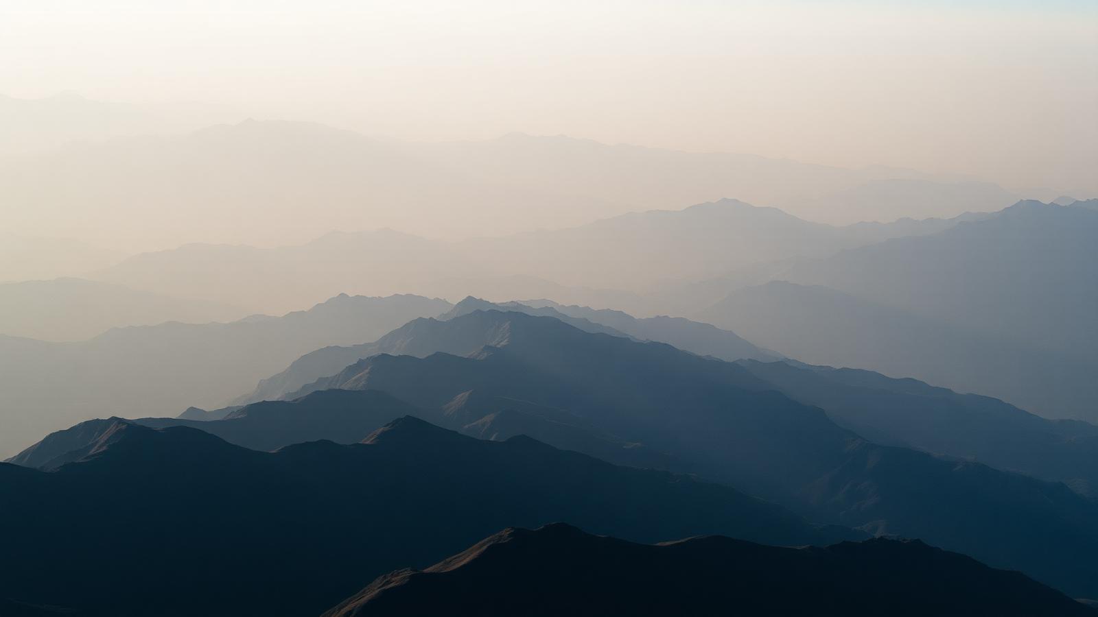 Tien Shan mountain ridges in atmospheric haze